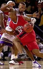 Tulsa's Eric Coley applies defensive pressure to Fresno State's Courtney Alexander in the first half Thursday.