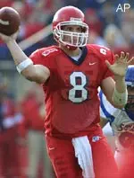 David Carr looks to throw as San Jose State's David Coat, rear, pursues in the second half Friday.