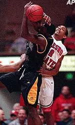 San Jose State's Darnell Williams, left, is stopped by Fresno State's Tito Maddox during the first half Thursday