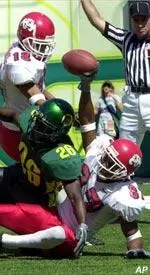 Deandre Gilbert celebrates with teammate Adam Jennings (18) after his first quarter touchdown catch. Gilbert caught an errant tipped pass for the first quarter score.