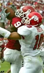 Fresno State defensive back Dee Meza defends a pass against Oklahoma receiver Mark Clayton Saturday in Norman, Okla.