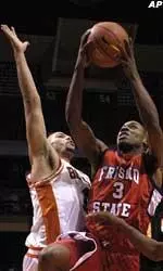 Fresno State guard Terry Pettis drives past Boise State's Bryan Defares during the first half at the BSU Pavillion.