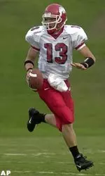 Paul Pinegar looks for one of his receivers while being pursued by Louisiana Tech defenders.