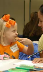 Sharing a laugh over pizza is one of the many joys that the Bulldogs get to experience by being Big Heroes at Children's Hospital.