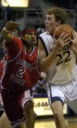 Nevada's Nick Fazekas looks to pass against Dreike Bouldin.