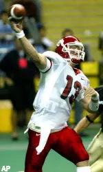 Fresno State quarterback Paul Pinegar passes under pressure in the first half against the University of Idaho. (AP Photo/Christopher Onstott)