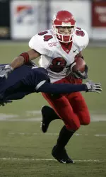 Fresno State receiver Joe Fernandez runs against Nevada defender Kevin Stanley in the first quarter. (AP Photo/Cathleen Allison)