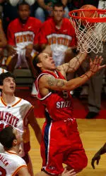 Fresno State's Dwight O'Neil, right, scores between Iowa State's Ross Marsden, top, and Jiri Hubalek during the first half. O'Neil scored eight points and had eight rebounds to go along with a steal and a block in the Bulldogs' 84-77 victory over the Cyclones (AP Photo/Steve Pope).