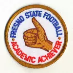 The Fresno State football teams gets a patented Pat Hill "thumbs up." Fresno State's Academic Progress Rate of 960 (out of 1000) ranks among the best of the 2005 college football bowl teams. Bulldog players receiving academic honors wear this patch on their jersey.