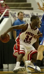 Fresno State's Ja'Vance Coleman handles the ball as he is guarded by Louisiana Tech's Wayne Powell in the second half. Fresno State won in overtime 84-81. (AP Photo/Jeff Chiu)
