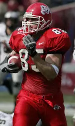Bear Pascoe runs past Hawaii's Adam Leonard, right, and other defenders for a touchdown during the first half. (AP Photo/Gary Kazanjian)