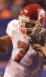 Tom Brandstater fights off a Bronco defender during the second half. (AP Photo/Matt Cilley)