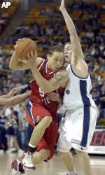Dwight O'Neil drives to the basket as Utah State's Jaycee Carroll defends during the first half. O'Neil has tallied double figure scoring games in five straight and eight of last nine.  AP Photo/Herald Journal, Meegan M. Reid)