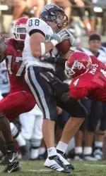 Marcus McCauley, left, and Vincent Mays tackle Nevada's Adam Bishop during the first half. (AP Photo/Gary Kazanjian)