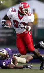 Dwayne Wright looks for another tackler after getting past Washington's Matt Fountaine during the first quarter.