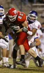 Bear Pascoe fights through Bronco defenders after making a reception Friday night in WAC play.