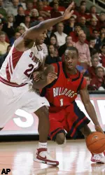 Fresno State's Kevin Bell, right, dribbles past Stanford's Kenny Brown during the second half. (AP Photo/Marcio Jose Sanchez)