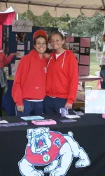Women's tennis players Melanie Gloria and Laura Pola volunteer at the Race For A Cure.