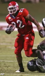 Anthony Harding twists and turns through Hawaii players during the first half.
