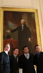 Gavin Hedstrom, Danny Grubb, Jordan Ribera and Steve Detwiler pose in front of the George Washington portrait in the White House on Wednesday.