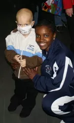 Senior guard Latoya Brown spends time with a patient from Children's Hospital Central California.