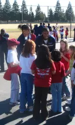 Erica Henry and Tierre Wilson set the kids up for a jump roping game.