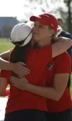 Siebert huggung head coach Angie Cates after winning the Kitahara Fresno State Invitational.