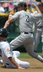Erik Wetzel turns a double play against Rice in the College World Series. Fresno State beat Rice 17-5 to advance.