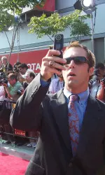 Steve Susdorf takes a cell photo while walking the red carpet at the 2008 ESPY Awards.