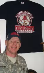 Major Kevin Polosky poses with his 2008 NCAA Championship shirt and hat.