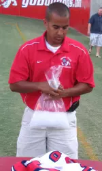 Fresno State alumnus Tony Hill enjoys working under the sun while guiding the Bulldog football athletic training staff.