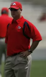 Hill answers questions and quickly solves situations to ensure a smooth operation for Bulldog football