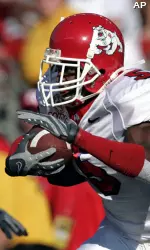 Wide receiver Marlon Moore looks for holes in the Rutgers defense in Monday's opener.