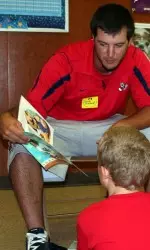 Senior Zac Bischoff reads to Kratt Elementary students.