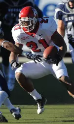 Nevada's Jonathon Amaya looks to tackle Fresno's Rayn Mathews during the first half. (AP Photo/Reno Gazette-Journal, Andy Barron)