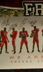 The first 50 customers who spend over $50 will receive a 2009 football poster signed by 12 of the players.