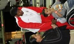 Paul George pushes a young man around at Monday's Christmas party at the Save Mart Center.