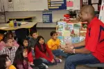 Chris Carter participates in Read Across America at Reagan Elementary.