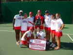 Brett Frank takes time to take a picture with the women's tennis team after winning the WAC championship this year.