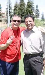 Erwin Higueros, shown at a recent Bulldog practice with head coach Pat Hill, will become the Spanish voice of the Bulldogs this fall.