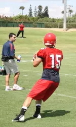Junior quarterback Ryan Colburn throws a pass during Thursday's practice. The Dogs opened fall camp to moderate temperatures.