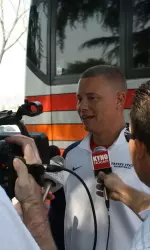 Adrian Wiggins speaks to the media before the team left the North Gym on Thursday.