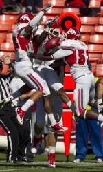 Cornerback L.J. Jones (center) celebrates his interception with teammates last weekend at Cal. It was one of two turnovers the 'Dogs forced in the game. Fresno State will have to do the same this weekend at Nebraska in order to win