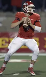 Derek Carr looks to pass.