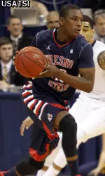 Marvelle Harris dribbles the ball.