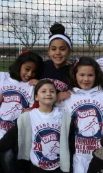 Some of the young girls at the Fresno State softball game cheering on the 'Dogs.