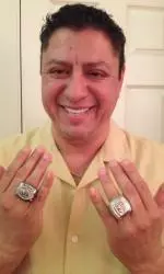Erwin Higueros sports his San Francisco Giants World Series and Mountain West championship rings