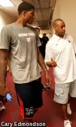Paul George talks with Fresno State head coach Rodney Terry during a visit to campus in 2012.