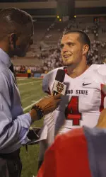 Carr speaks to sideline reporter Lewis Johnson following the 'Dogs victory against Rutgers
