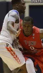 Marvelle Harris is defended by Pepperdine guard Atif Russell during the first half.